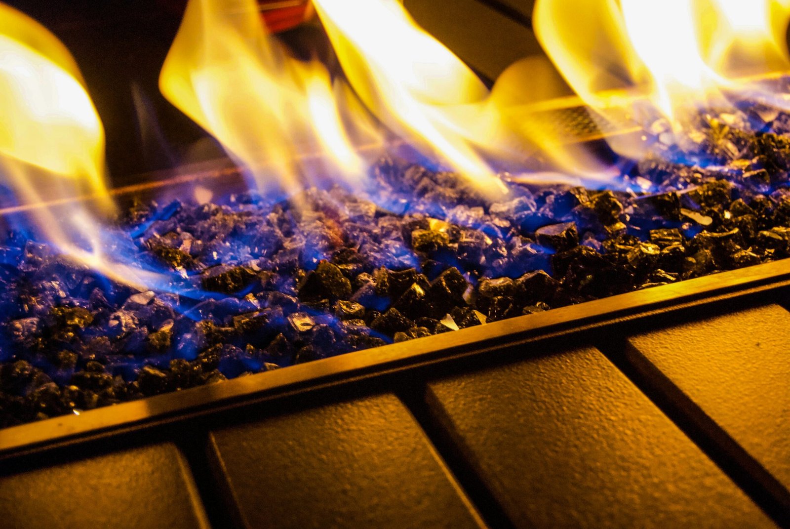 Restored gas fireplace with clean blue flames